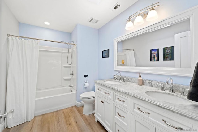 full bathroom featuring shower / bathtub combination with curtain, vanity, toilet, and wood-type flooring