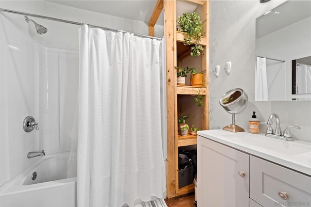 bathroom featuring vanity and shower / bath combination with curtain