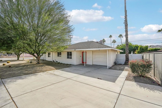 single story home featuring a garage