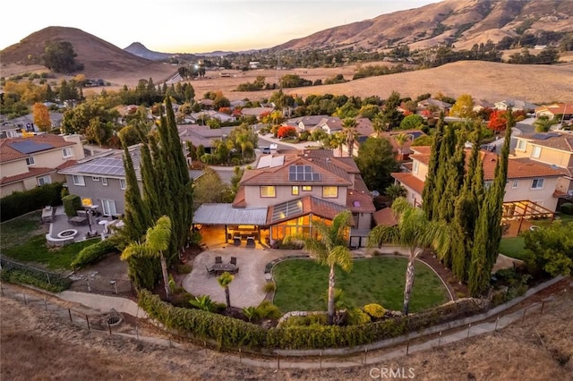 aerial view at dusk with a mountain view