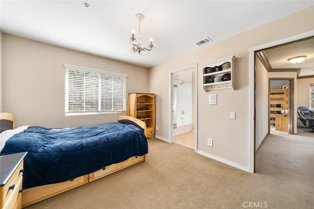 carpeted bedroom with crown molding, connected bathroom, and a chandelier