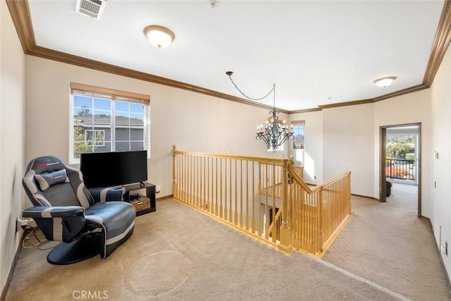 sitting room with ornamental molding, light colored carpet, and a notable chandelier