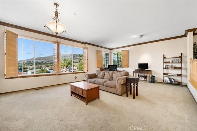 living room featuring crown molding and light carpet