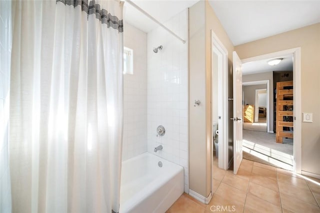 bathroom featuring tile patterned floors, toilet, and shower / bath combo