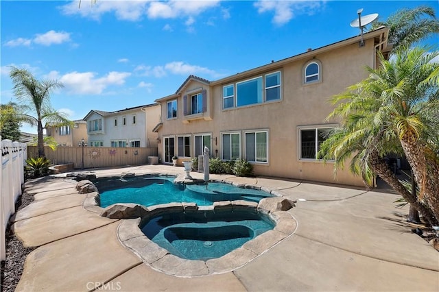 view of pool with an in ground hot tub