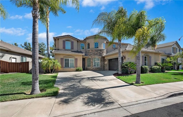 mediterranean / spanish-style home with a front lawn