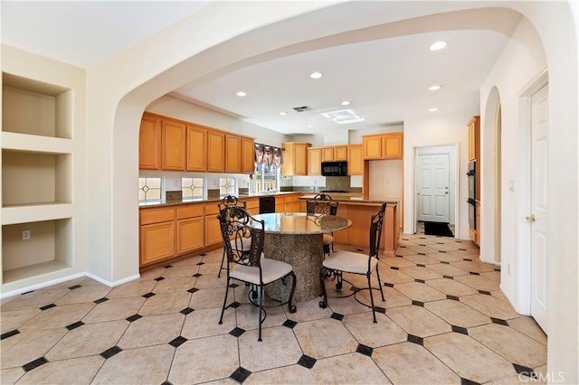 dining room with built in shelves