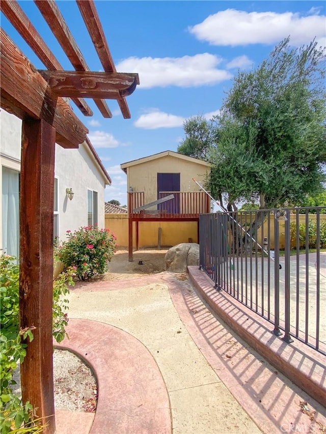 view of patio with fence and a pergola