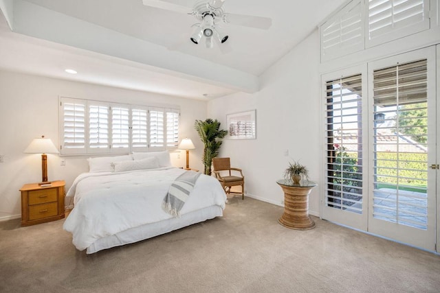 carpeted bedroom with access to outside, multiple windows, lofted ceiling, and ceiling fan