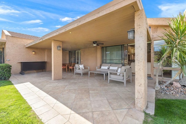 view of patio featuring ceiling fan and an outdoor living space