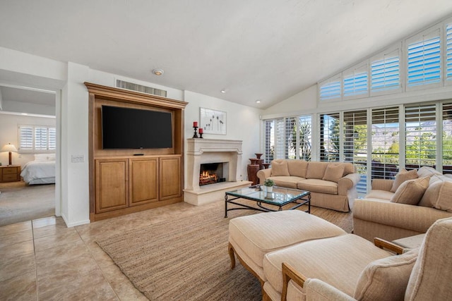 tiled living room with high vaulted ceiling and plenty of natural light