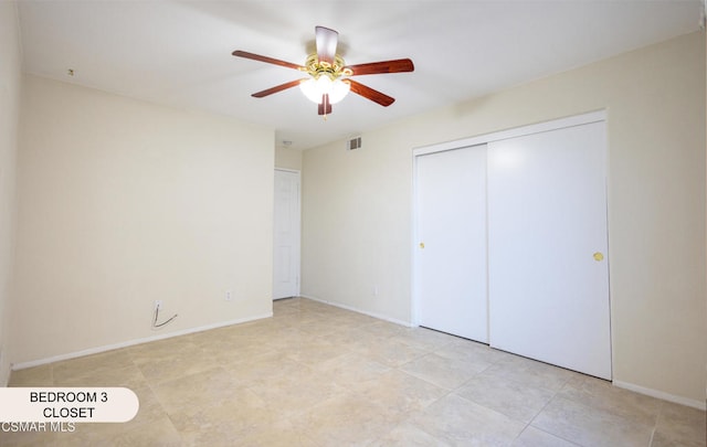 unfurnished bedroom featuring a closet and ceiling fan