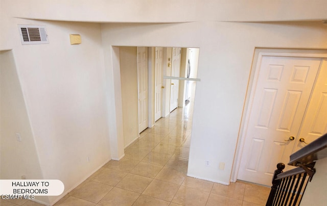 hallway featuring light tile patterned floors