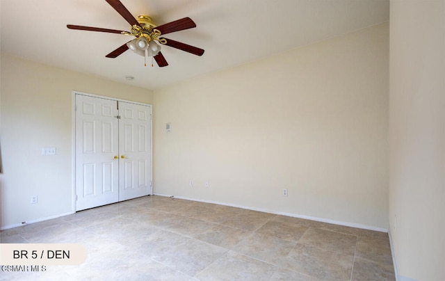 unfurnished bedroom with ceiling fan, light tile patterned flooring, and a closet