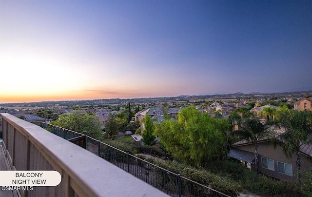 view of balcony at dusk