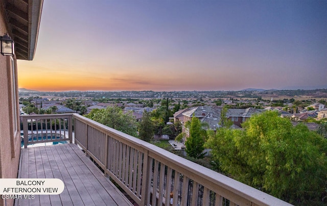 view of balcony at dusk