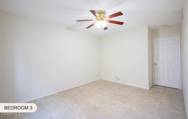 empty room featuring ceiling fan