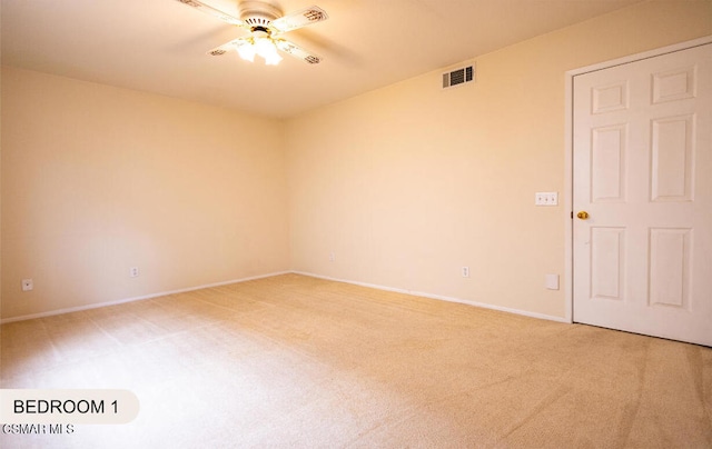 empty room featuring carpet flooring and ceiling fan