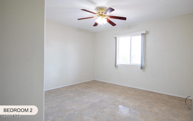 unfurnished room with ceiling fan