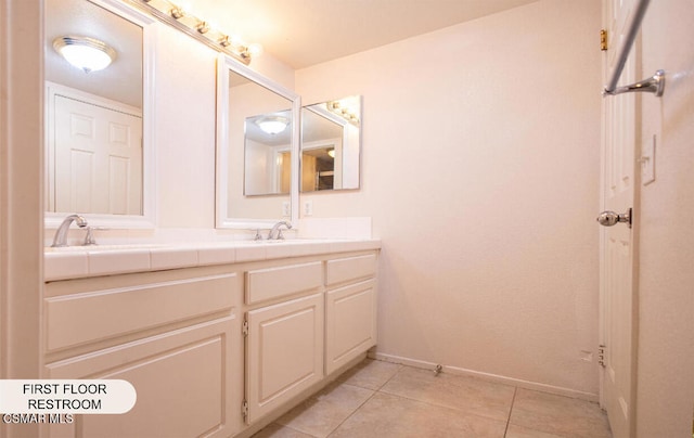 bathroom featuring tile patterned flooring and vanity