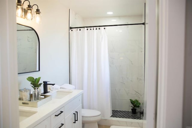 bathroom with a shower with curtain, vanity, and toilet