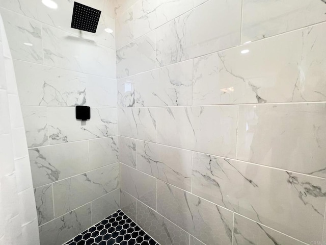 bathroom with tiled shower