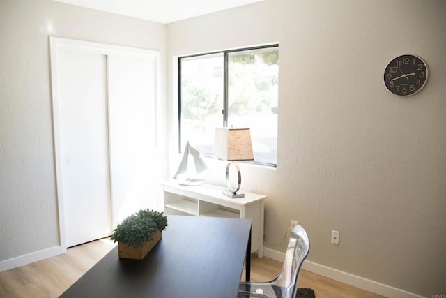 office area with light hardwood / wood-style flooring