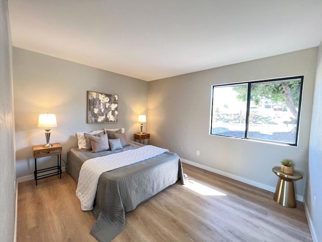 bedroom with light hardwood / wood-style flooring