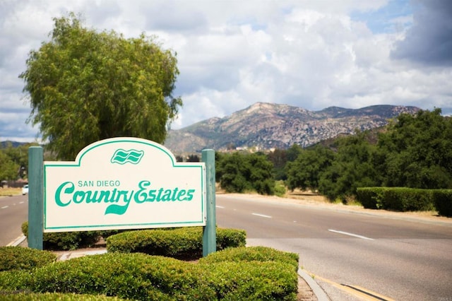 community sign featuring a mountain view