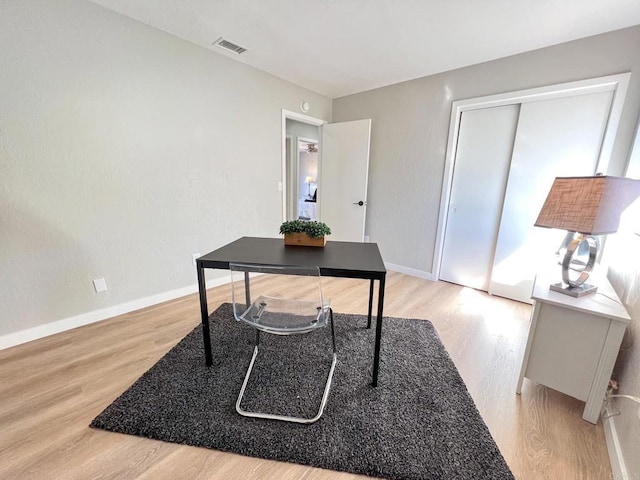 office area with light hardwood / wood-style floors