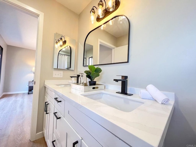 bathroom with vanity and hardwood / wood-style floors