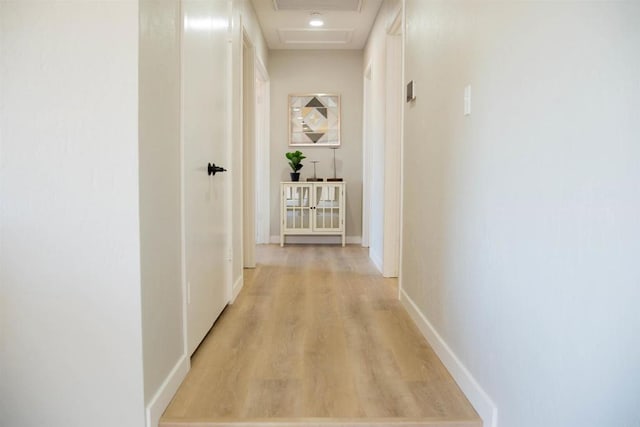 hallway with light wood-type flooring