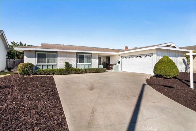 ranch-style house featuring a garage