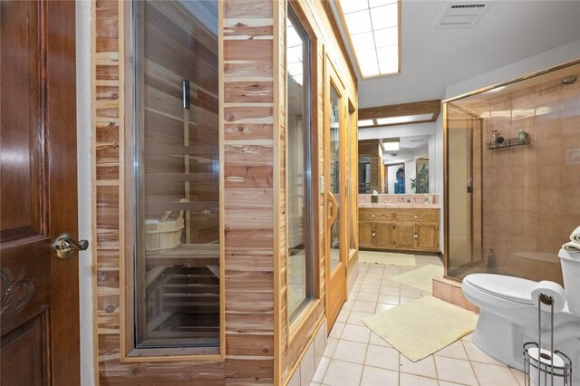 160 Yosemite Dr, Big Bear City, CA 92314 - bathroom with tile patterned flooring, toilet, a sauna, vanity, and a shower stall
