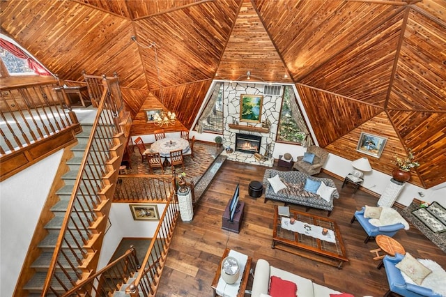 unfurnished living room with wooden ceiling, a fireplace, and hardwood / wood-style floors