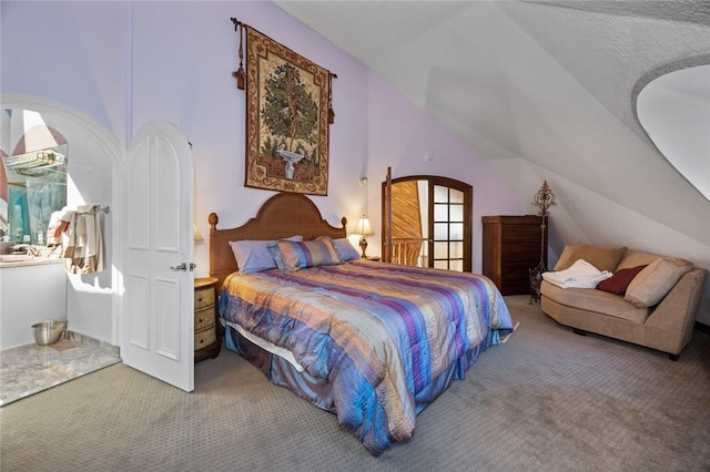 bedroom with lofted ceiling and carpet floors