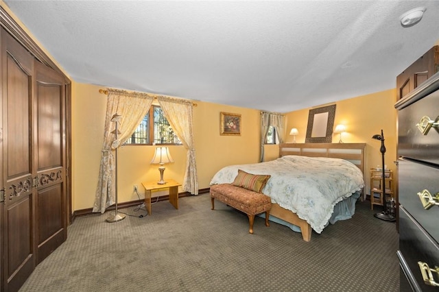 bedroom with carpet, a textured ceiling, and a closet