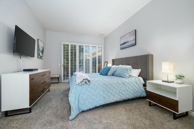 bedroom with light colored carpet