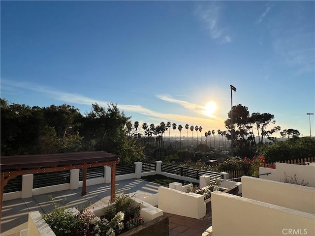 view of patio terrace at dusk