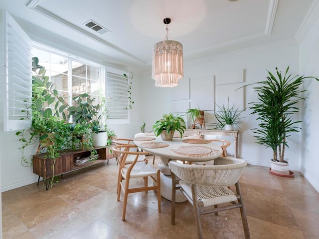 dining area with a chandelier and ornamental molding