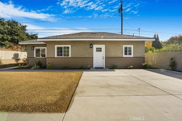 ranch-style home with a patio