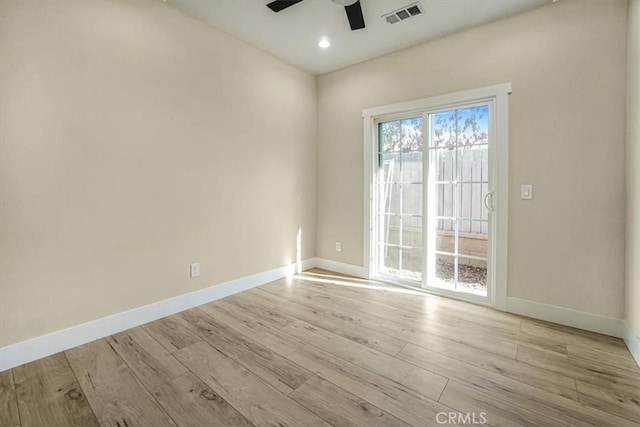 unfurnished room featuring ceiling fan and light hardwood / wood-style flooring