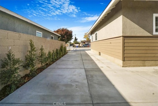 view of property exterior featuring a patio area