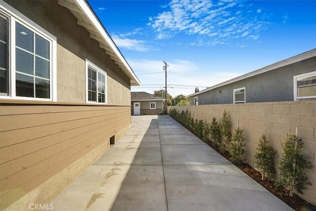 view of side of home featuring a patio