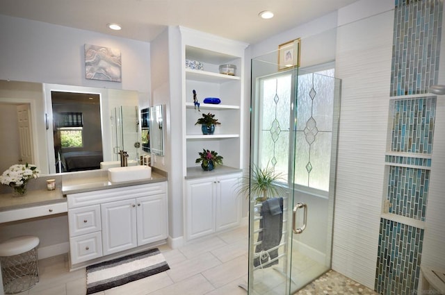 bathroom featuring vanity, tile patterned floors, and an enclosed shower