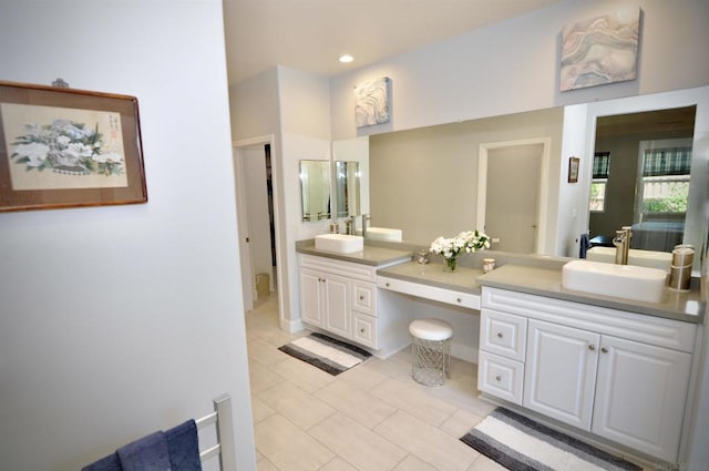 bathroom with tile patterned flooring and vanity