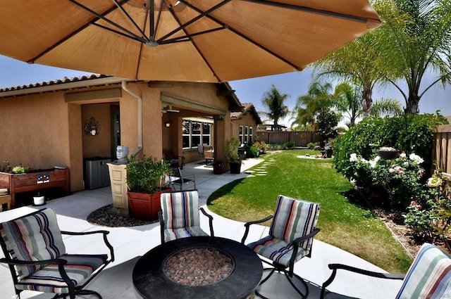 view of patio / terrace with an outdoor fire pit