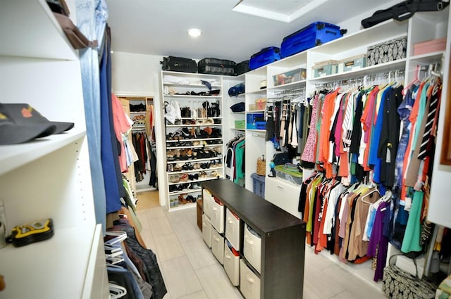 walk in closet featuring light tile patterned floors