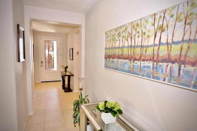 hallway featuring light tile patterned floors