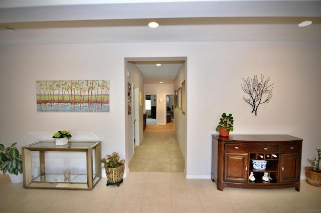 hallway featuring light tile patterned floors